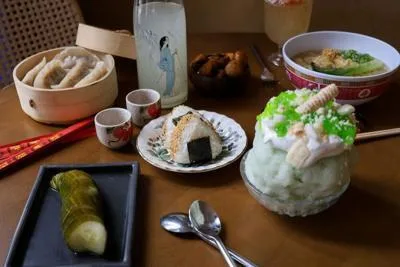 A Bareo spread of dumplings, onigiri, sake and shaved ice