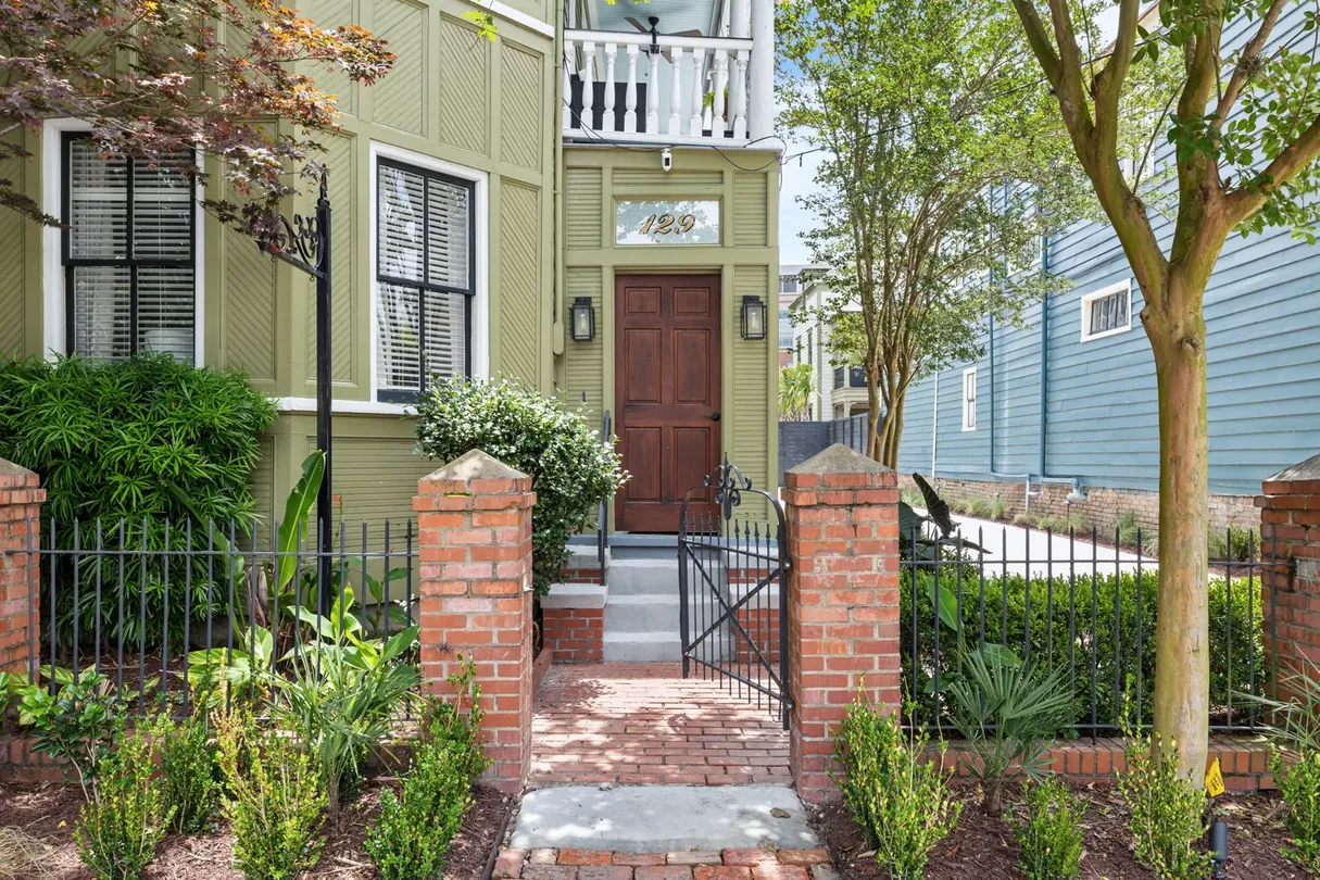 The front gate and brick steps of The Mint Julep Residence