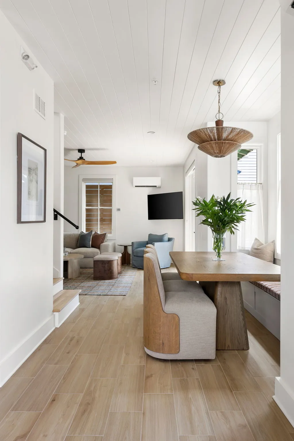 The dining nook opening into the living room