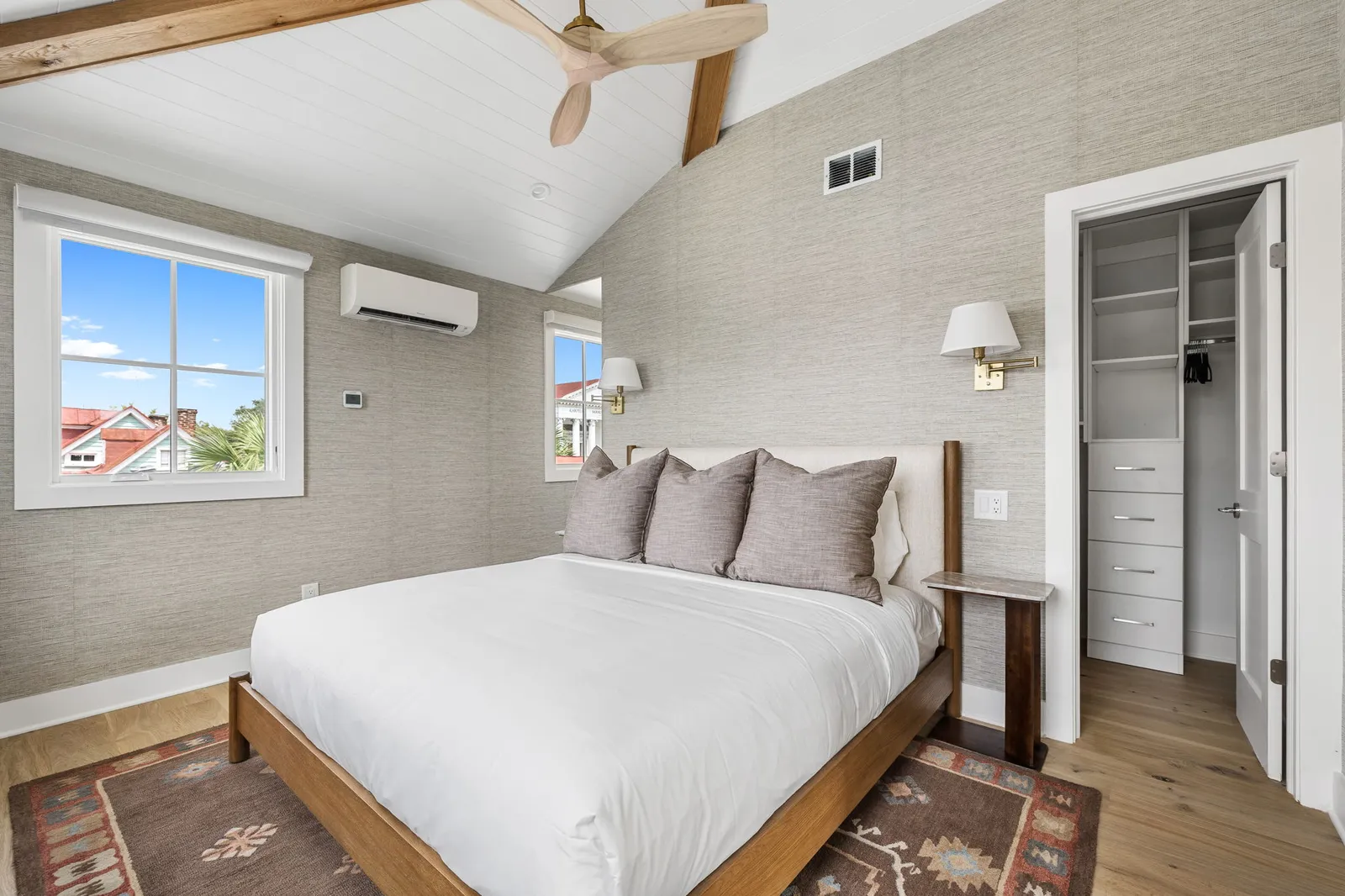 The third floor primary suite with pitched ceilings