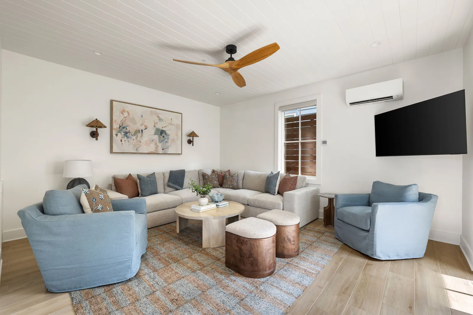 The second residence's living room in soft blue and cream