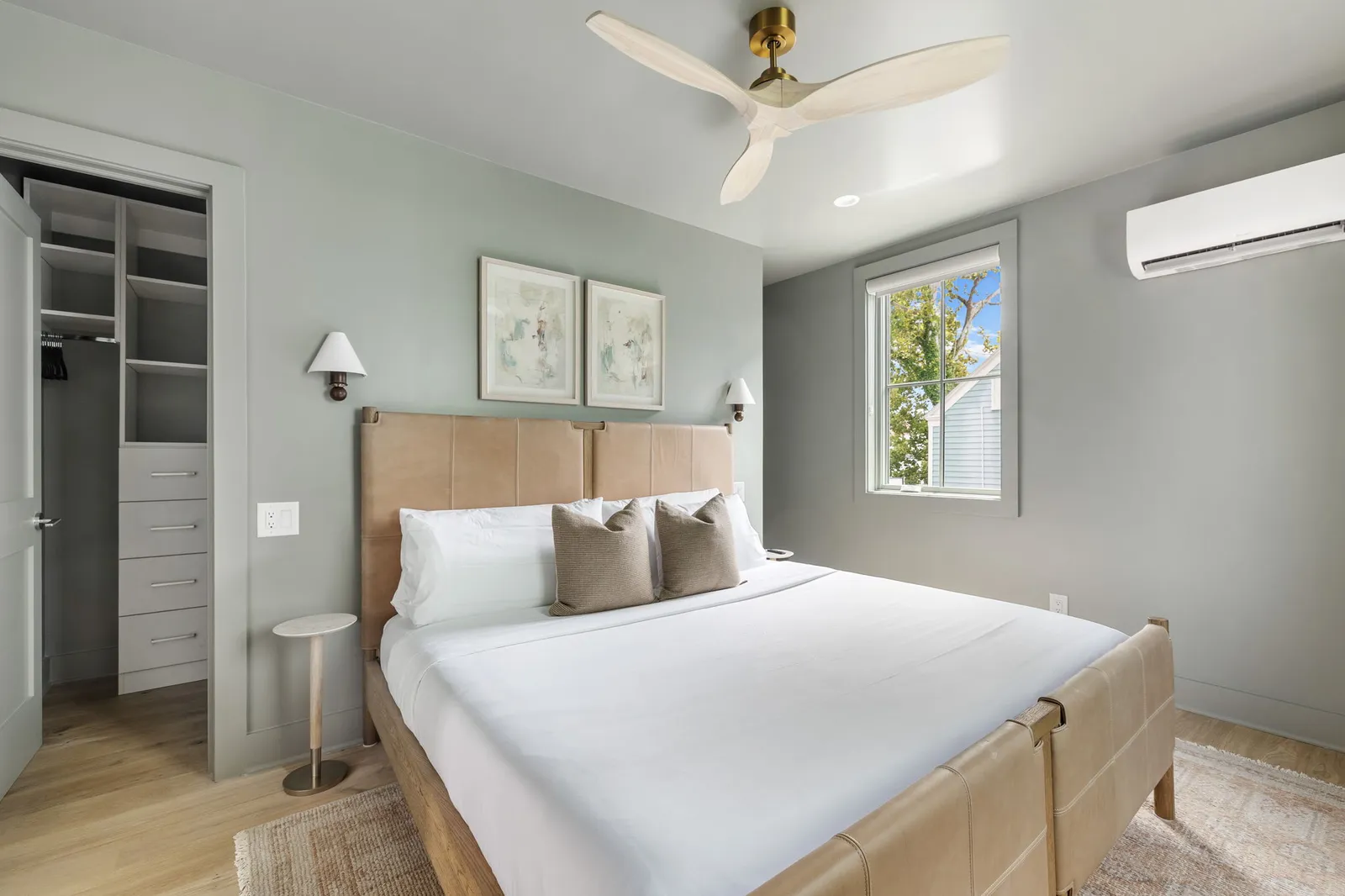 A king bedroom with a leather headboard and its own ensuite