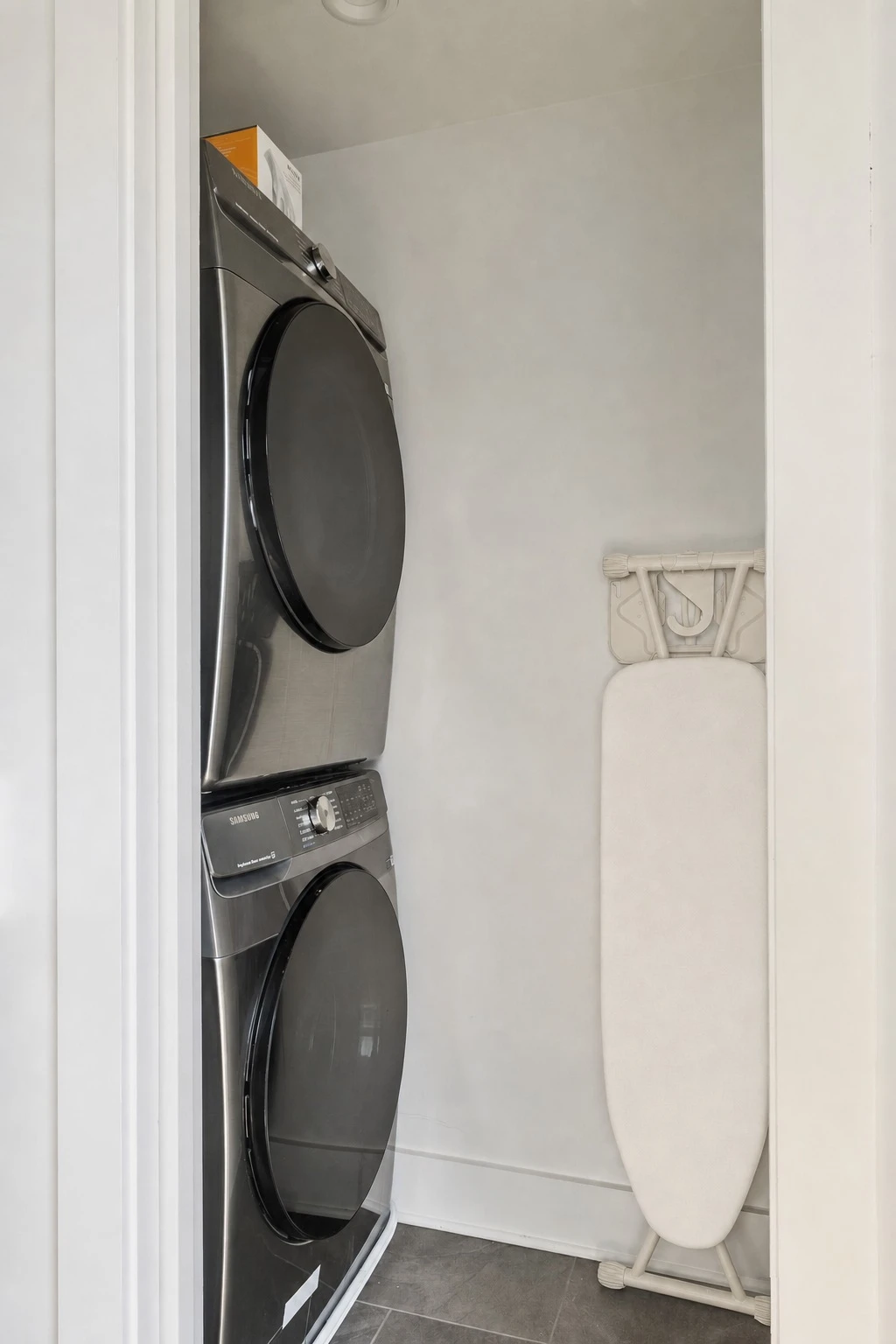 The stacked washer and dryer in the third floor suite