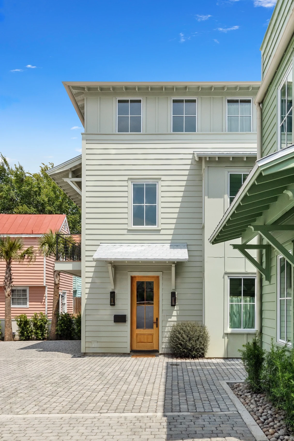 The two sister Signature Residences side by side at Smalls Alley, off the paver courtyard