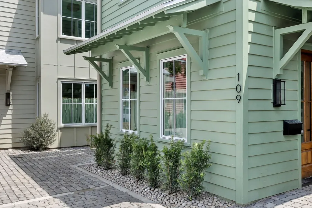 The private entrance of 109 Smalls Alley off the paver courtyard